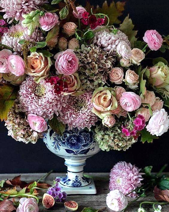 Pink roses and hydrangea in a blue and white vase